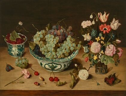 Grapes in a wan-li porcelain kraak, raspberries in a wan-li beaker, tulips, roses and other flowers in a glass vase