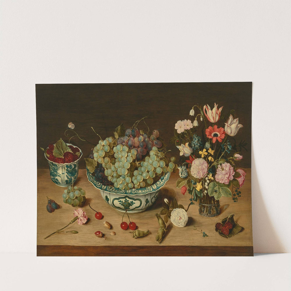 Grapes in a wan-li porcelain kraak, raspberries in a wan-li beaker, tulips, roses and other flowers in a glass vase by Isaak Soreau