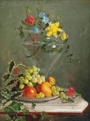 Holly, ivy, grapes, apples and oranges in a bowl by a vase of flowers including daffodils and phlox, on a marble ledge — size preview