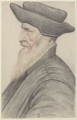 Homme à longue barbe blanche, coiffé d’un bonnet noir à bord relevé, de profil à gauche