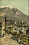 Houses along a road near a mountain