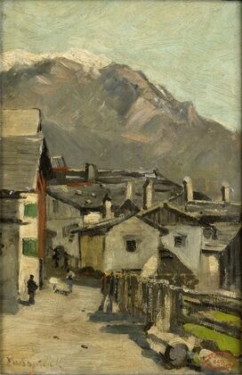 Houses along a road near a mountain