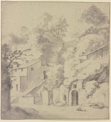 Houses in front of a cliff