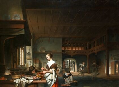 Kitchen interior with a woman cooking 