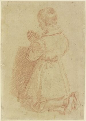Kneeling, praying boy