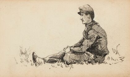 Militaire assis sur l’herbe