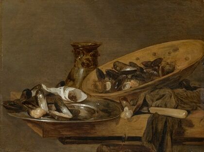 Mussels in pewter and earthenware plates with an upturned roemer, on a wooden table — size preview