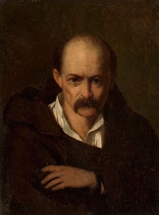 Portrait of a man in handcuffs