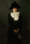 Portrait of a young woman with a rose in her hand