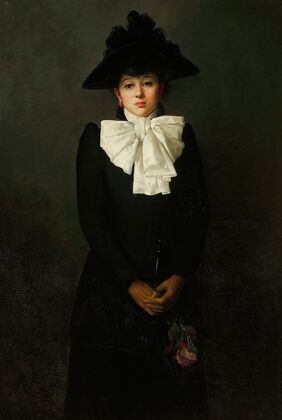 Portrait of a young woman with a rose in her hand
