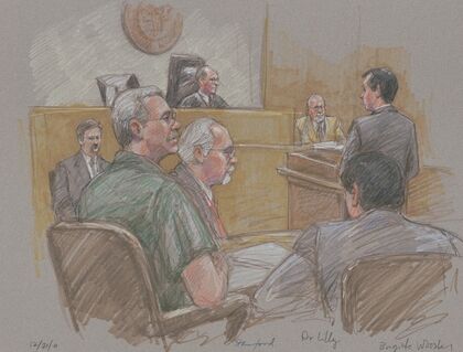 Robert Allen Stanford, seated in courtroom with lawyers, judge, and others during his trial for financial fraud