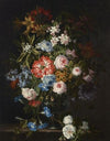 Roses, lilies, tulips, daffodils, morning glories and other flowers in a glass vase on a stone ledge
