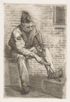 Soldier cleaning his rifle
