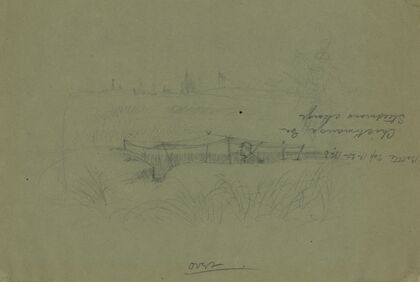 Soldier standing in a rifle pit covered by a canopy