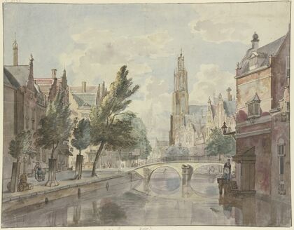 Steinbrücke über einen Kanal, im Hintergrund eine Kathedrale, rechts am Haus eine Laterne