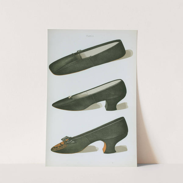 Three black satin shoes. The third is the Jubliee Shoe, embroidered with the Royal Crown and initials V. R., with motto 'God save the Queen' by T. Watson Greig