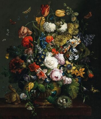 Tulips, daffodils, roses and other flowers in a vase on a stone ledge with butterflies and a bird’s nest