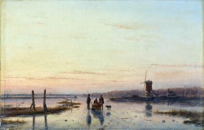 Windmill beside a frozen river