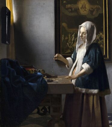 Woman Holding a Balance