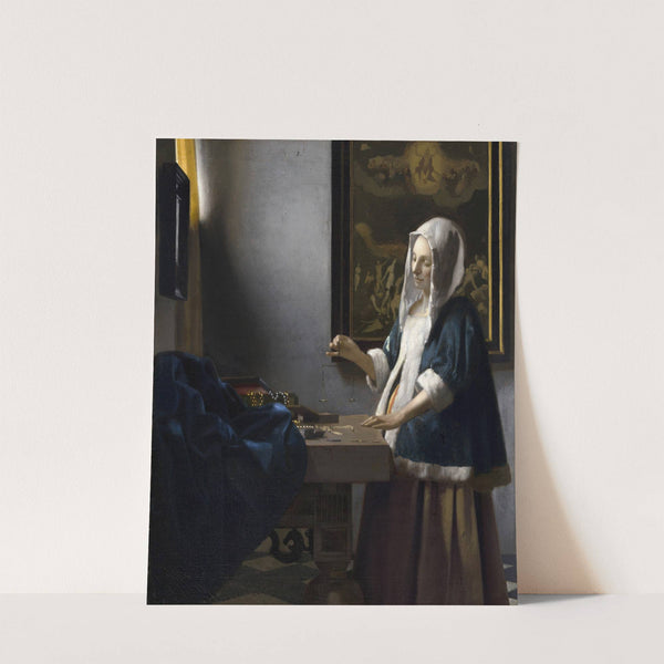 Woman Holding a Balance by Johannes Vermeer
