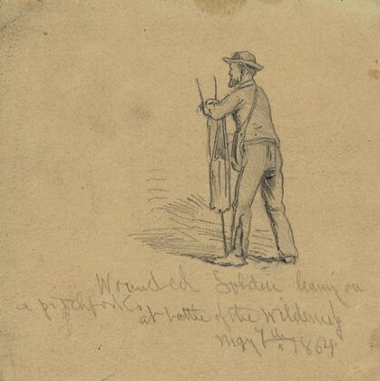 Wounded soldier leaning on a pitchfork at Battle of the Wilderness, May 7, 1864