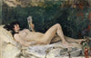 Young Woman Lying on a Bed and Reading
