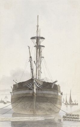 Zeilschip van voren gezien in een houthaven