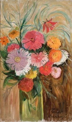 Zinnias and asters in a glass jar