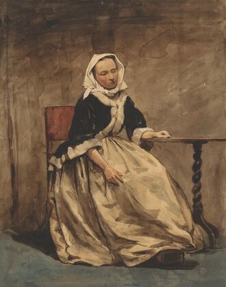 Zittende vrouw naast een kleine tafel